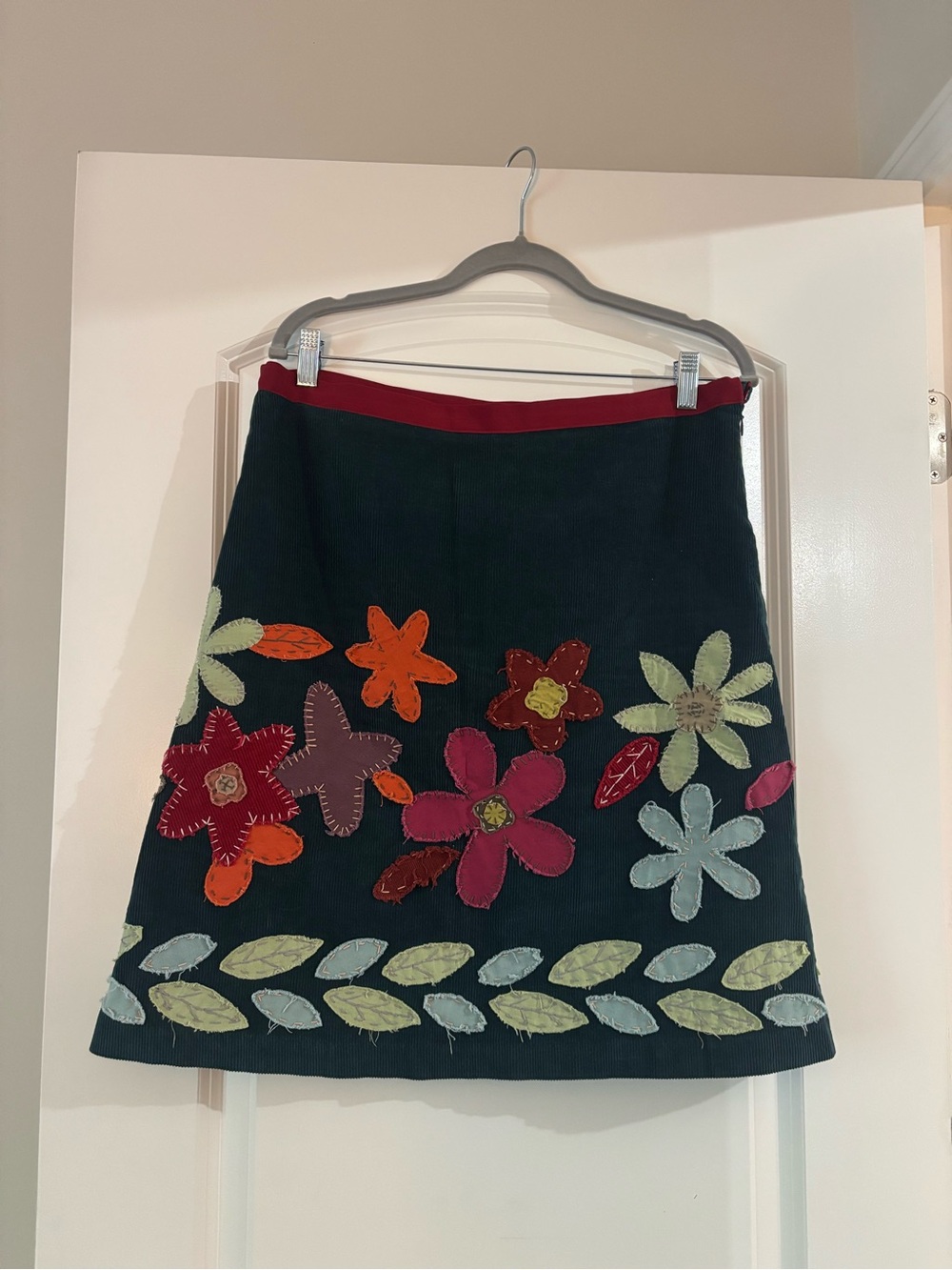 Boden Navy A-Line Skirt with Multicolor Floral Appliqués and Red Waistband